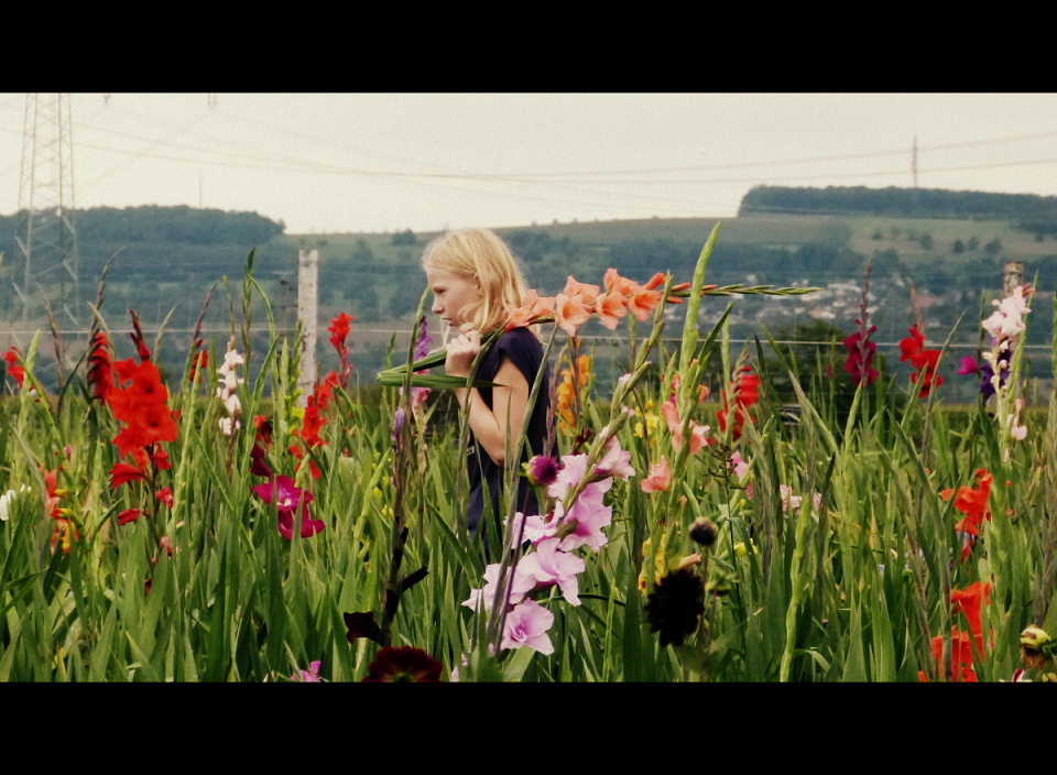  Even picking flowers she ...