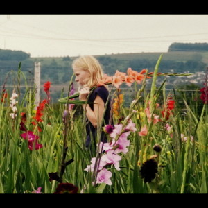  Even picking flowers she ...