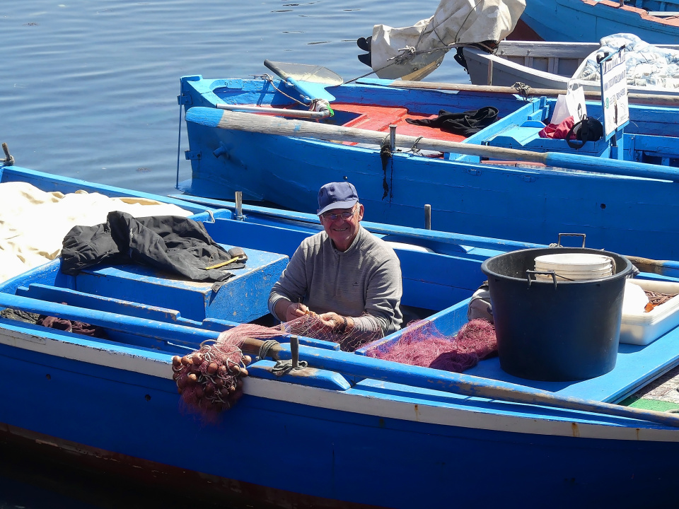 Net mending fisherman